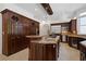 Gourmet kitchen with granite countertops, custom cabinets, and stainless steel appliances at 4340 Candacraig, Johns Creek, GA 30022