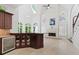 Open-concept kitchen with wine cooler, granite countertops and seamless flow to the living area at 4340 Candacraig, Johns Creek, GA 30022