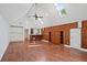 Spacious living room with hardwood floors, beamed ceilings, built-in shelves, and a bar area at 4340 Candacraig, Johns Creek, GA 30022