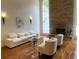 Cozy living room with stone fireplace and windows bringing in natural light at 4340 Candacraig, Johns Creek, GA 30022