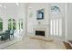 A beautiful living room with a fireplace, vaulted ceilings, arch windows and lots of natural light at 4340 Candacraig, Johns Creek, GA 30022
