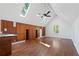 Bright living room featuring hardwood floors, built-in shelving, and a vaulted ceiling with skylights at 4340 Candacraig, Johns Creek, GA 30022