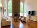 Living room with high ceilings, fireplace, hardwood floors and tall windows at 4340 Candacraig, Johns Creek, GA 30022