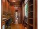 Wood-paneled office space with custom desk, shelves, and natural light at 4340 Candacraig, Johns Creek, GA 30022