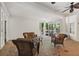 Cozy screened-in porch with comfortable wicker furniture and stone flooring at 4340 Candacraig, Johns Creek, GA 30022
