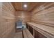 Private sauna room featuring wood plank walls, built in seating, and classic sauna heater at 4340 Candacraig, Johns Creek, GA 30022