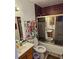 Bathroom featuring a tiled shower/tub combo and a single sink vanity at 908 Pine Oak Trl, Austell, GA 30168