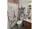 Bathroom showcasing a Paris-themed shower curtain and a traditional vanity at 908 Pine Oak Trl, Austell, GA 30168