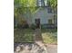 Two-story exterior featuring beautiful greenery and a welcoming front entrance at 908 Pine Oak Trl, Austell, GA 30168
