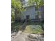 Two-story exterior featuring beautiful greenery and a welcoming front entrance at 908 Pine Oak Trl, Austell, GA 30168