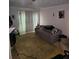 Cozy living room with a comfortable sofa and neutral decor at 908 Pine Oak Trl, Austell, GA 30168