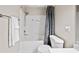 Bathroom showcases a shower/tub combo with white tile and a shower curtain, along with modern fixtures at 2324 Towneheights Se Ter # 11, Atlanta, GA 30339