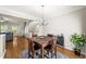 Open dining area with hardwood floors and view into living room and kitchen at 2324 Towneheights Se Ter # 11, Atlanta, GA 30339