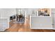 Hardwood floor dining area with an adjacent kitchen and natural lighting at 2324 Towneheights Se Ter # 11, Atlanta, GA 30339