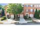 Brick townhouse with manicured landscaping, attached garages, and inviting front entrances at 2324 Towneheights Se Ter # 11, Atlanta, GA 30339