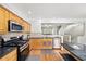 Bright kitchen boasts stainless steel appliances, granite counters, and hardwood floors at 2324 Towneheights Se Ter # 11, Atlanta, GA 30339