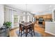 Cozy dining area with hardwood floors and adjacent kitchen with stainless steel appliances at 2324 Towneheights Se Ter # 11, Atlanta, GA 30339