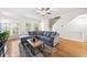 Bright living room with hardwood floors, comfortable sofa, and abundant natural light at 2324 Towneheights Se Ter # 11, Atlanta, GA 30339