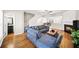 Inviting living room with hardwood floors, comfortable seating, and a cozy fireplace at 2324 Towneheights Se Ter # 11, Atlanta, GA 30339
