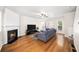 Spacious living room featuring hardwood floors, a fireplace, and ample natural light at 2324 Towneheights Se Ter # 11, Atlanta, GA 30339