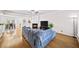 Open-concept living room with hardwood floors, fireplace, and seamless flow to dining area at 2324 Towneheights Se Ter # 11, Atlanta, GA 30339