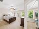 Bright bedroom with a fan, and an attached walk-in closet, complemented by a neutral color scheme at 2324 Towneheights Se Ter # 11, Atlanta, GA 30339
