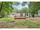 Charming home with a wooden back deck, enhances the outdoor appeal, blending indoor and outdoor living at 2450 Elkhorn Dr, Decatur, GA 30034