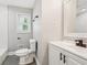 This renovated bathroom has a new vanity, toilet, shower and tub at 2450 Elkhorn Dr, Decatur, GA 30034