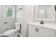 This renovated bathroom has a new vanity, toilet, window, and shower at 2450 Elkhorn Dr, Decatur, GA 30034