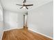 This bedroom features hardwood floors, neutral paint, a ceiling fan, and a closet at 2450 Elkhorn Dr, Decatur, GA 30034