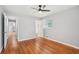 Bedroom with hardwood flooring, ceiling fan, and attached bathroom at 2450 Elkhorn Dr, Decatur, GA 30034