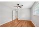 This bedroom features hardwood floors, neutral paint, a ceiling fan, and a closet at 2450 Elkhorn Dr, Decatur, GA 30034