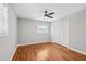 This spacious bedroom boasts hardwood floors, a ceiling fan, neutral paint, and a closet at 2450 Elkhorn Dr, Decatur, GA 30034