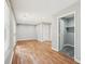 Bonus room featuring hardwood flooring, neutral paint, and modern lighting at 2450 Elkhorn Dr, Decatur, GA 30034