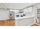 Bright kitchen with white cabinets, stainless steel appliances, and hardwood floors at 2450 Elkhorn Dr, Decatur, GA 30034
