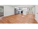 Open kitchen and living area with hardwood floors, white cabinets, and modern appliances at 2450 Elkhorn Dr, Decatur, GA 30034