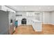 Modern kitchen featuring white cabinets, stainless steel appliances, and a center island at 2450 Elkhorn Dr, Decatur, GA 30034