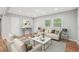 Bright living room features stylish furniture, hardwood floors, and lots of natural light from the windows at 2450 Elkhorn Dr, Decatur, GA 30034