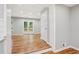 Bright living room features hardwood flooring, neutral paint, and a door to backyard deck at 2450 Elkhorn Dr, Decatur, GA 30034