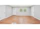 Bright and open living room with hardwood floors, light gray walls, and natural light at 2450 Elkhorn Dr, Decatur, GA 30034