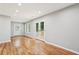 Spacious living room with hardwood floors and views to the deck at 2450 Elkhorn Dr, Decatur, GA 30034