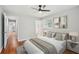 Spacious bedroom with ceiling fan, natural light, and access to bathroom at 2450 Elkhorn Dr, Decatur, GA 30034
