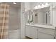 Bathroom features tub, shower combo with a large mirror and granite vanity at 970 Sidney Marcus Ne Blvd # 2408, Atlanta, GA 30324