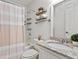 Bathroom with tub and shower combination, granite countertop and decorative shelves at 970 Sidney Marcus Ne Blvd # 2408, Atlanta, GA 30324