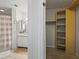 En suite bathroom next to closet has a shower/tub combo and granite vanity at 970 Sidney Marcus Ne Blvd # 2408, Atlanta, GA 30324