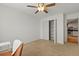 Bright bedroom features a ceiling fan, closet, neutral paint, and carpeted floors at 970 Sidney Marcus Ne Blvd # 2408, Atlanta, GA 30324