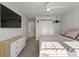 Spacious bedroom features a flat-screen TV and stylish contemporary decor at 970 Sidney Marcus Ne Blvd # 2408, Atlanta, GA 30324