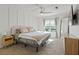 Sunlit bedroom with modern decor, large window, plush carpet, and sleek ceiling fan at 970 Sidney Marcus Ne Blvd # 2408, Atlanta, GA 30324