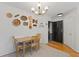 Dining room featuring a wooden table, a modern chandelier, and decorative wall art at 970 Sidney Marcus Ne Blvd # 2408, Atlanta, GA 30324