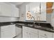 Updated kitchen showcasing stainless steel appliances, white cabinets, and modern countertops at 970 Sidney Marcus Ne Blvd # 2408, Atlanta, GA 30324